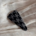 Detail shot of a British style black and grey houndstooth triangle hair clip on linen fabric - Black Gray Houndstooth Large Triangle Style