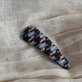 Detailed view of handmade knitted triangular hair clip with blue and brown checkered pattern - Navy White Houndstooth Thin Triangle Style