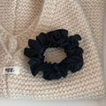 Close-up of black satin scrunchie with silk gloss on soft knit background texture - Black (Multi-pleat Style)