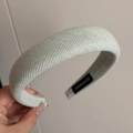Close-up of light green knit fabric texture and handmade label on padded headband - Basic Padded Headband / White