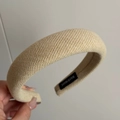 Detailed view of beige padded fabric headband showing handmade label and woven texture - Basic Padded Headband / Yellow