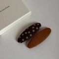 Dettaglio di fermagli per capelli BB in tessuto floreale e a righe color cammello - Coppia di Fermagli Ovali