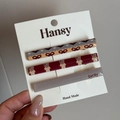Dettaglio del set di tre fermagli per capelli con stampe di orsi e scritta Lucky - Set Orsetto - Giallo Rosso Grigio