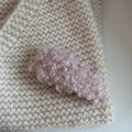 Detailed close-up of pink lamb wool hair clip on beige knitwear showing soft texture - Rice Pink