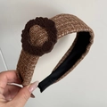 Macro shot of a vintage brown tweed headband featuring a velvet floral button detail - 3D Flower Wide Headband / Brown