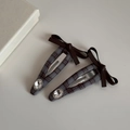 Close-up of grey plaid fabric hair clips with leather bows and large oval rhinestones - Coffee Plaid - Rhinestone Bow BB Clips