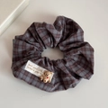 Detailed close-up of brown checkered scrunchie with cute 3D bear and textile label tag - Coffee Plaid - Bear Scrunchie