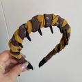 Detail of hand-woven floral fabric headband with integrated functional black plastic clips - Orange Coffee Patchwork - Long Tooth Headband