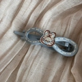 Detail of light blue infinity hair clip with cute plaid bunny and white stitch pattern - Blue