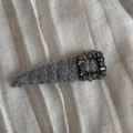 Macro view of grey plush hair clip featuring a luxury crystal rectangle ornament buckle - Light Gray Square