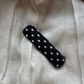 Detailed view of handmade black fabric hair clip with white embroidered polka dot pattern - Polka Dot Rectangle Clip / Black