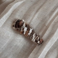 Macro detail of hand-knitted wool hair clip in warm gradient brown and white tones - Gradient Wool Triangle Clip - Colorful White
