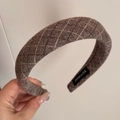 Close-up of brown wool headband featuring white rhombus stitching and Hand Made woven label - Basic Rhombus Style / Brown