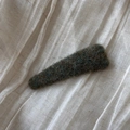 Close-up of textured dark green felt fabric hair clip on soft white gauze background - Triangle Solid Color Woolen - Green