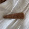 Detail view of the brown felt hair clip texture on a minimalist beige linen background - Triangle Solid Color Woolen - Yellow Coffee