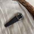 Close-up of a dark grey tweed hair clip with a square rhinestone buckle on fabric - Hollow Square Rhinestone Gray Triangle BB Clip / Gray