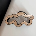 Close-up of irregular wave hair claw with brown polka dot pattern and hollow center - Khaki Polka Dot Cloud Style
