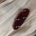 Close-up of burgundy knit hair clip with sparkling rhinestone bows on soft fabric - Rhinestone Bow Oval - Red
