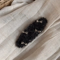 Close-up of black fuzzy wool hair clip featuring four elegant silver metal bow accents - Rhinestone Bow Oval - Black Grey