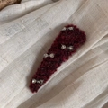 Close-up of a burgundy knitted hair clip featuring four silver rhinestone bow accents - Rhinestone Bow Triangle - Red