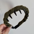 Detail showing the olive green yarn-wrapped band and black anti-slip inner teeth of the headband - Green