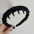 Detail showing the fiber texture and black punk spikes of this woven headband accessory - Black