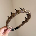 Detail of plaid fabric headband with black non-slip inner teeth for secure hair styling - Plaid Wrapped Long Tooth Hoop / Yellow Coffee