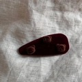 Close-up of a burgundy velvet hair clip featuring three 3D flocked brown bear heads - Burgundy