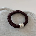 Detail of burgundy pleated silk hair scrunchie with a silver metallic bead accent - Dark Coffee