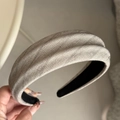 Detailed close-up of herringbone fabric headband with textured finish and non-slip lining - Beige Padded Headband