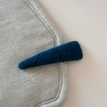 Detailed macro view of a dark blue wool felt hair clip on a textured linen surface - Solid Color Woolen Triangle BB Clip / Blue