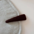 Macro shot of dark brown felt fabric texture on a minimalist triangular hair clip - Solid Color Woolen Triangle BB Clip / Dark Coffee