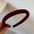 Detailed close-up of handmade burgundy wool fabric headband featuring a black woven label - Solid Color Woolen Narrow Headband / Red