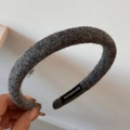Detailed macro view of handmade grey wool felt headband texture and brand label - Solid Color Woolen Narrow Headband / Gray
