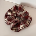 Detailed close-up of brown plaid scrunchie with handmade woven label on fabric - Plaid Scrunchie - Red