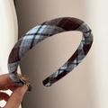 Detailed close-up of a brown plaid fabric scrunchie with soft autumn check pattern - Padded Plaid Headband - Blue