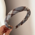 Detailed close-up of brown plaid fabric headband with a handmade label inside - Padded Plaid Headband - Gray