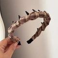 Close-up of brown plaid fabric headband featuring black non-slip inner teeth detail - Toothed Plaid Headband - Coffee