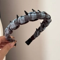 Detailed view of the anti-slip black plastic teeth inside the plaid fabric headband - Toothed Plaid Headband - Blue