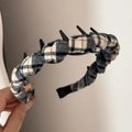 Detail of brown plaid fabric headband with black plastic inner teeth for secure hair grip - Toothed Plaid Headband - Beige Black