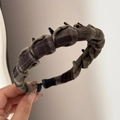 Detail showing brown plaid fabric headband with inner plastic teeth for extra grip - Toothed Plaid Headband - Dark Brown