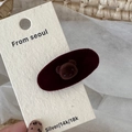 Detail of cute brown flocked bear on a dark red velvet oval hair clip for styling - Burgundy