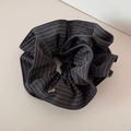 Macro detail of dark grey striped fabric hair scrunchie with silver heart metal pendant - Striped Tie Scrunchie - Dark Gray
