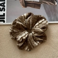 Detail showing soft knit texture and striped pattern of an oversized brown scrunchie - Patterned Woolen Circle - Coffee