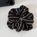 Detailed view of the black and white striped knit texture on a soft oversized scrunchie - Lazy Vertical Stripe Circle / Brown