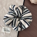 Detailed view of the striped knit scrunchie texture with vibrant multi-colored fabric patterns - Beige