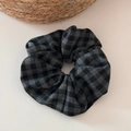 Detail of a large grey plaid scrunchie with soft fabric texture on a minimal background - Grey Plaid Scrunchie - Black