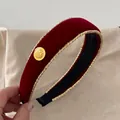 Detail of red velvet headband with golden braided edges and vintage metal button accent - Red Velvet Headband