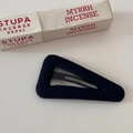 Detailed macro shot of a navy blue triangular fabric hair clip on a white background - Hollow Triangle BB Clip - Black