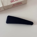 Detailed close-up of a geometric triangle hair clip featuring premium twill fabric texture - Slim Triangle BB Clip - Black